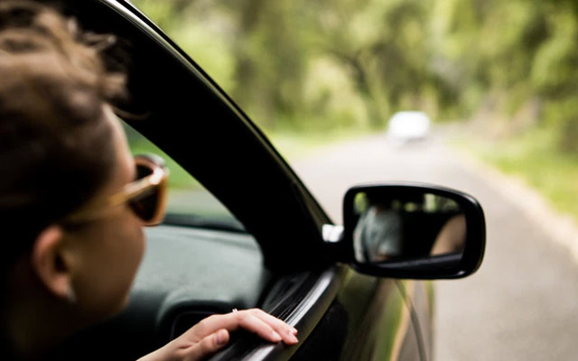 Girl looking out of car window