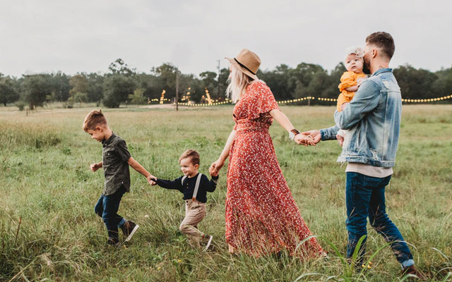 Family walking in field